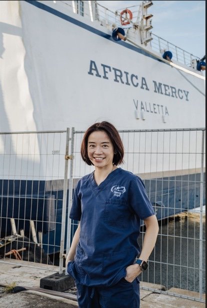 Dr. Janet Hung in front of the Africa Mercy
